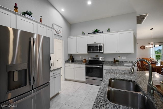 2804 NW 6th St, Cape Coral, FL 33993 - kitchen featuring stainless steel appliances, light tile patterned floors, white cabinets, stone counters, and recessed lighting