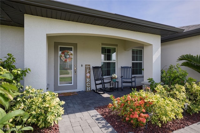 2804 NW 6th St, Cape Coral, FL 33993 - property entrance featuring stucco siding and covered porch