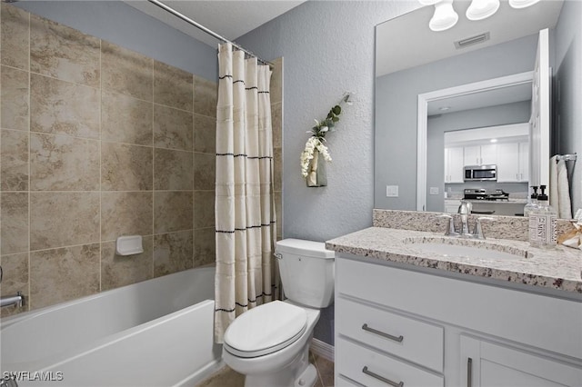 14040 Heritage Landing Blvd Unit 115, Punta Gorda, FL 33955 - full bathroom featuring a textured wall, vanity, and shower / bathtub combination with curtain