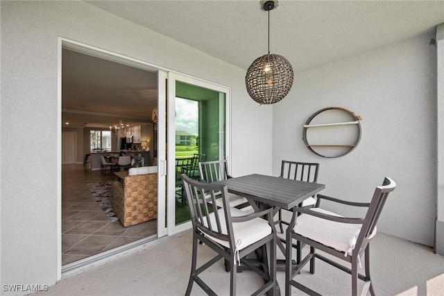14040 Heritage Landing Blvd Unit 115, Punta Gorda, FL 33955 - dining room with a chandelier, a textured wall, and a textured ceiling
