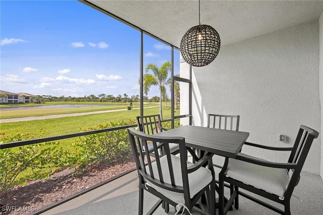 14040 Heritage Landing Blvd Unit 115, Punta Gorda, FL 33955 - sunroom / solarium with a water view and outdoor dining area