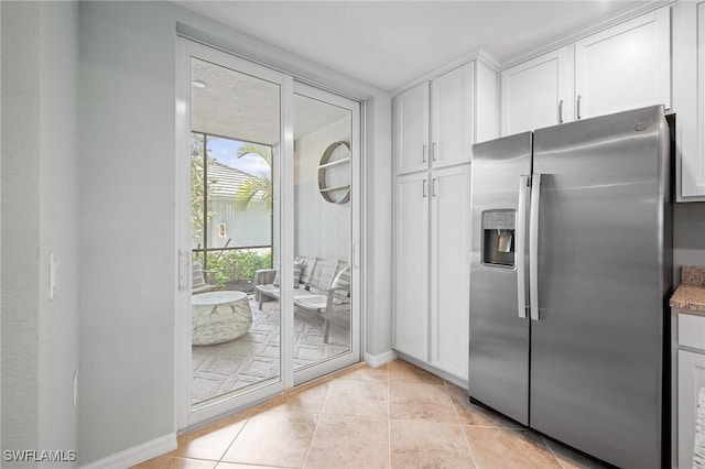 14040 Heritage Landing Blvd Unit 115, Punta Gorda, FL 33955 - kitchen featuring stainless steel fridge with ice dispenser, white cabinets, light tile patterned flooring, and light stone countertops