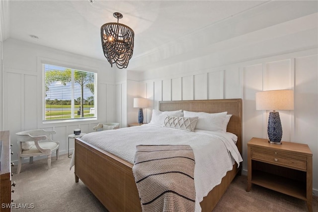 14040 Heritage Landing Blvd Unit 115, Punta Gorda, FL 33955 - bedroom featuring a decorative wall, a chandelier, and carpet flooring