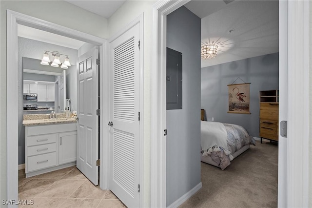14040 Heritage Landing Blvd Unit 115, Punta Gorda, FL 33955 - bathroom featuring electric panel, vanity, a chandelier, and connected bathroom