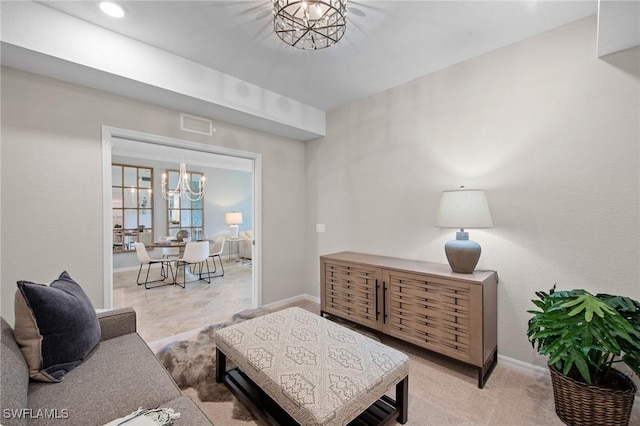 14040 Heritage Landing Blvd Unit 115, Punta Gorda, FL 33955 - living area featuring a chandelier and baseboards