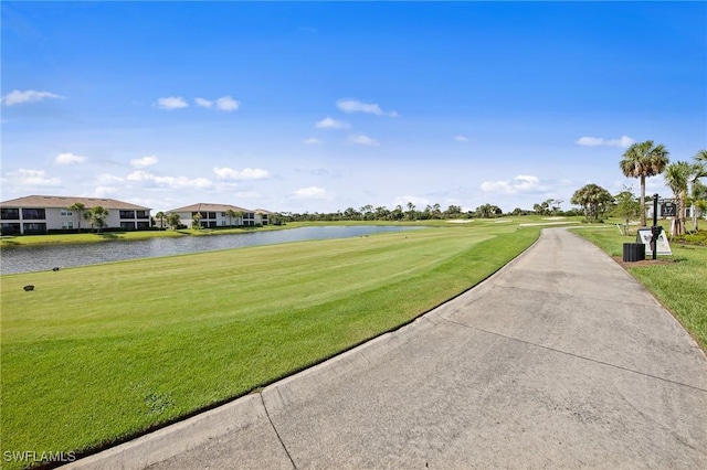 14040 Heritage Landing Blvd Unit 115, Punta Gorda, FL 33955 - view of property's community featuring a water view, a yard, and golf course view