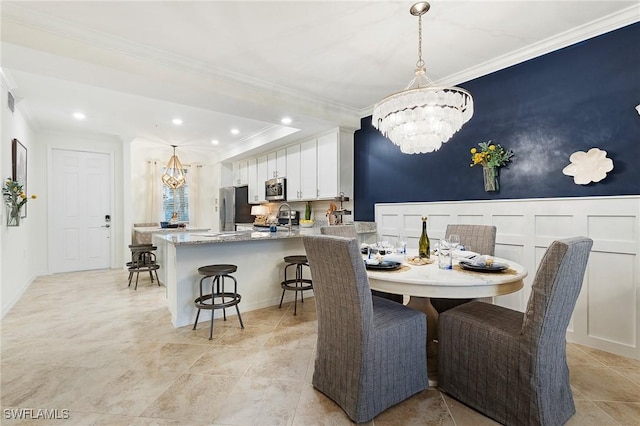 14040 Heritage Landing Blvd Unit 124, Punta Gorda, FL 33955 - dining room featuring a chandelier, crown molding, and recessed lighting