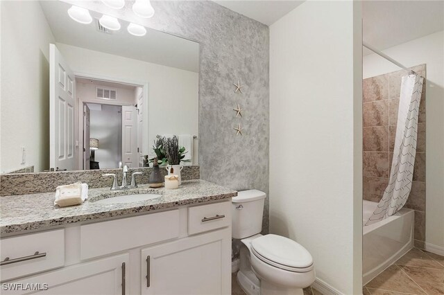 14040 Heritage Landing Blvd Unit 124, Punta Gorda, FL 33955 - bathroom with vanity, tile patterned floors, and shower / bath combo with shower curtain