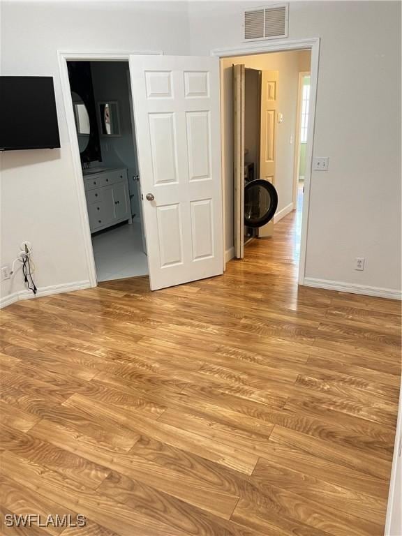 8241 Pacific Beach Dr, Fort Myers, FL 33966 - unfurnished room with light wood finished floors and baseboards