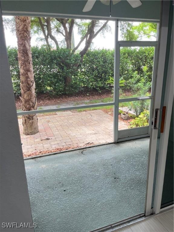 8241 Pacific Beach Dr, Fort Myers, FL 33966 - doorway to outside featuring ceiling fan