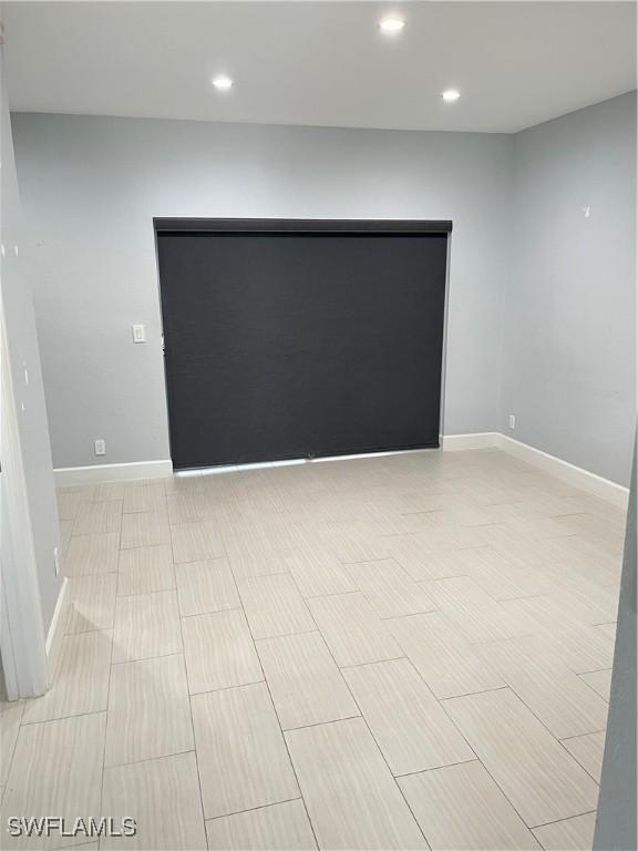 8241 Pacific Beach Dr, Fort Myers, FL 33966 - spare room featuring recessed lighting and baseboards
