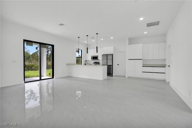2616 42nd St W, Lehigh Acres, FL 33971 - unfurnished living room featuring recessed lighting and concrete flooring