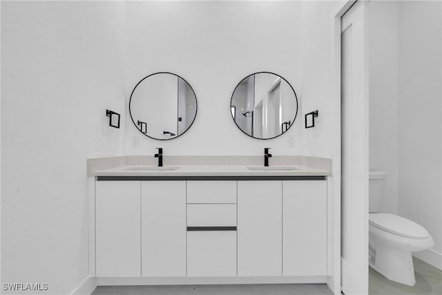 2616 42nd St W, Lehigh Acres, FL 33971 - bathroom with double vanity and toilet