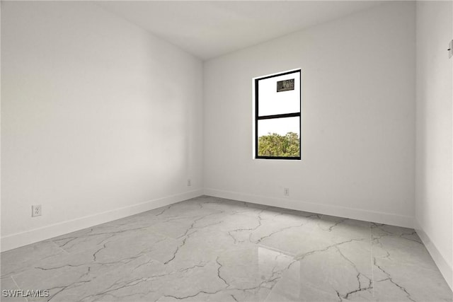 2616 42nd St W, Lehigh Acres, FL 33971 - unfurnished room with light marble finish flooring and baseboards