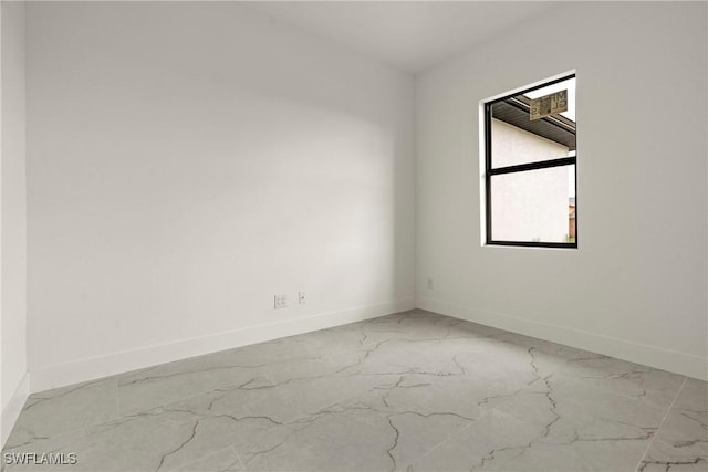 2616 42nd St W, Lehigh Acres, FL 33971 - unfurnished room with marble look tile flooring and baseboards