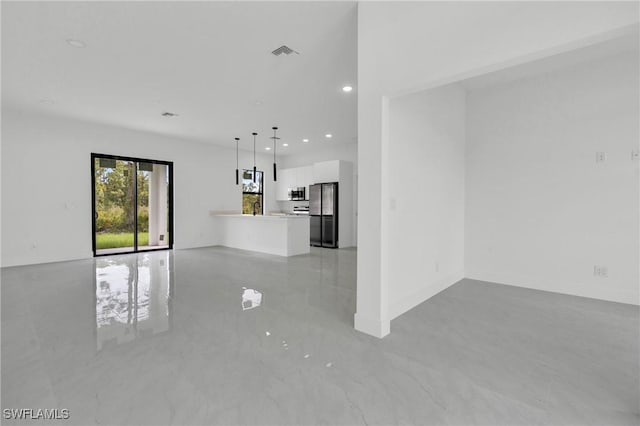 2616 42nd St W, Lehigh Acres, FL 33971 - unfurnished living room with light marble finish flooring and recessed lighting