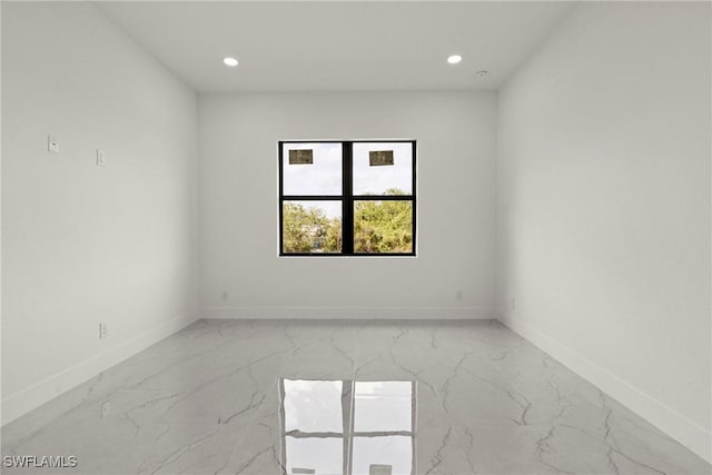 2616 42nd St W, Lehigh Acres, FL 33971 - empty room with light marble finish flooring and recessed lighting