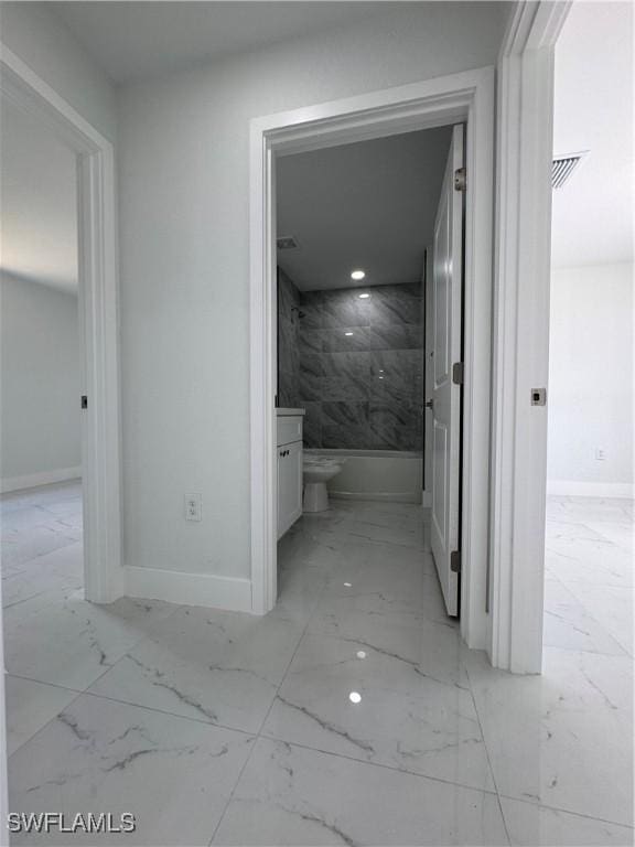 2902 27th St SW, Lehigh Acres, FL 33976 - hallway with light marble finish flooring