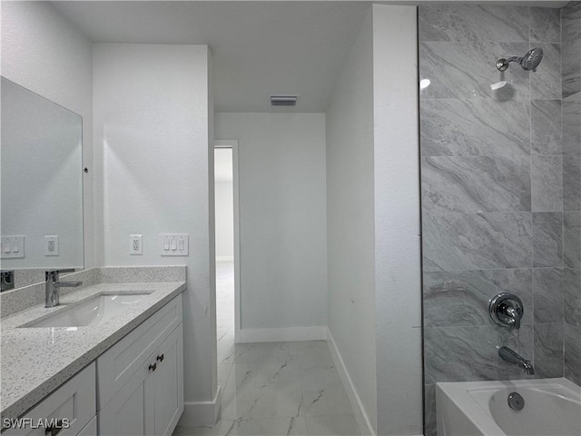 2902 27th St SW, Lehigh Acres, FL 33976 - full bath featuring marble look tiles, vanity, and shower / tub combination