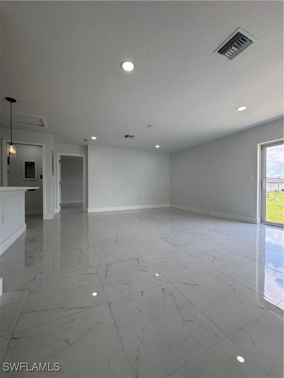 2902 27th St SW, Lehigh Acres, FL 33976 - unfurnished room featuring light marble finish floors and recessed lighting