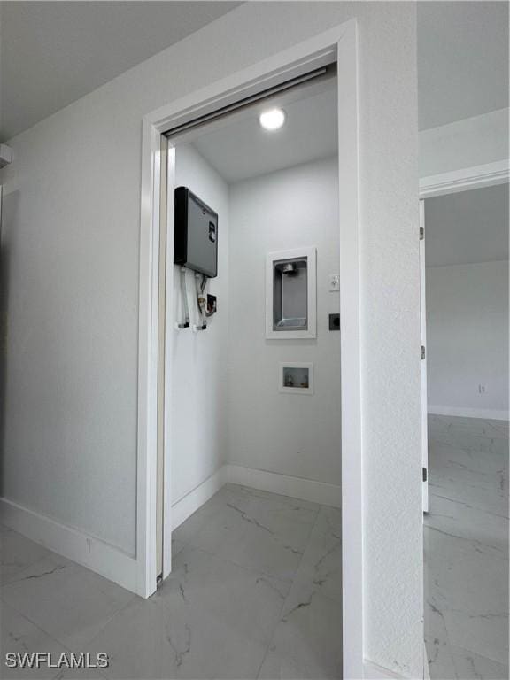 2902 27th St SW, Lehigh Acres, FL 33976 - hall with marble look tile flooring and baseboards