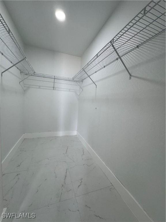 2902 27th St SW, Lehigh Acres, FL 33976 - walk in closet with marble look tiles