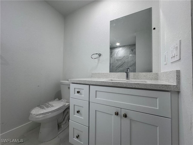 2902 27th St SW, Lehigh Acres, FL 33976 - bathroom featuring vanity, a shower, and marble finish flooring