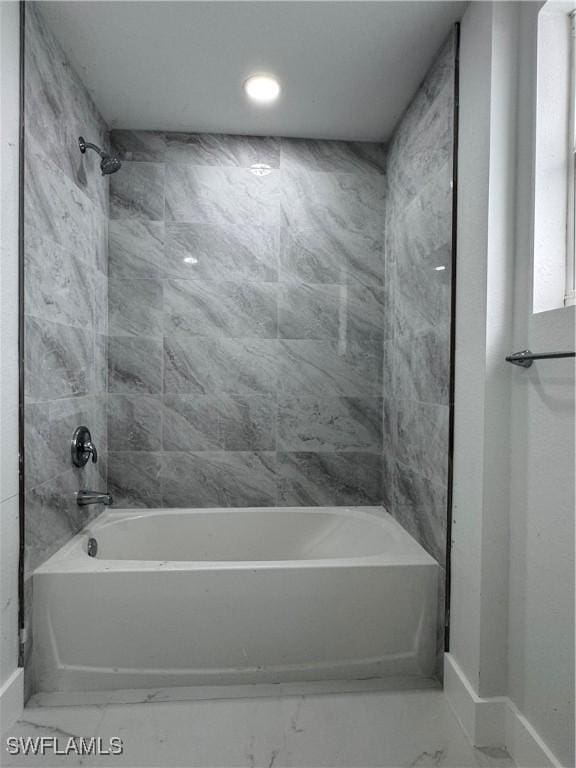 2902 27th St SW, Lehigh Acres, FL 33976 - full bath featuring shower / bath combination and marble look tiles