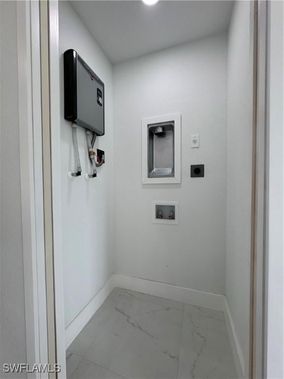2902 27th St SW, Lehigh Acres, FL 33976 - laundry area with marble look tile flooring, washer hookup, and hookup for an electric dryer