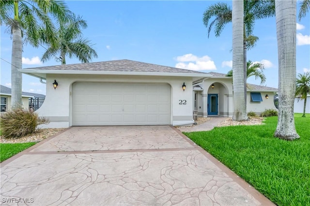 22 NW 14th Ave, Cape Coral, FL 33993 - ranch-style home featuring stucco siding, driveway, an attached garage, and a front lawn