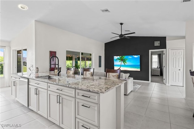 22 NW 14th Ave, Cape Coral, FL 33993 - kitchen featuring dishwasher, light stone counters, lofted ceiling, ceiling fan, and plenty of natural light
