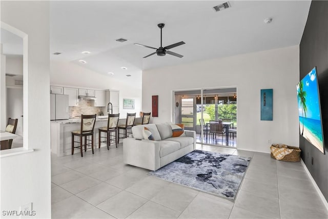 22 NW 14th Ave, Cape Coral, FL 33993 - living area with light tile patterned floors, ceiling fan, and lofted ceiling