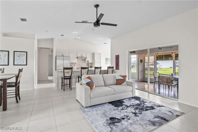 22 NW 14th Ave, Cape Coral, FL 33993 - living area with vaulted ceiling, a ceiling fan, and light tile patterned floors
