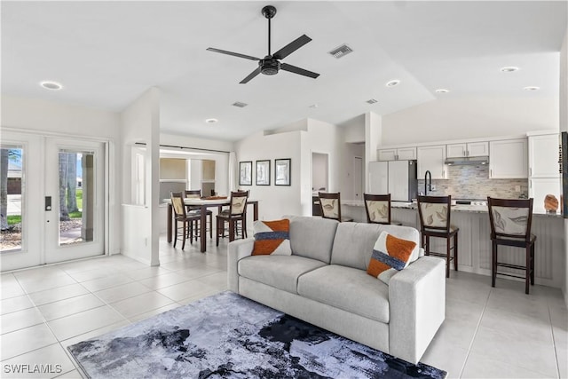 22 NW 14th Ave, Cape Coral, FL 33993 - living area with light tile patterned flooring, french doors, lofted ceiling, and a ceiling fan