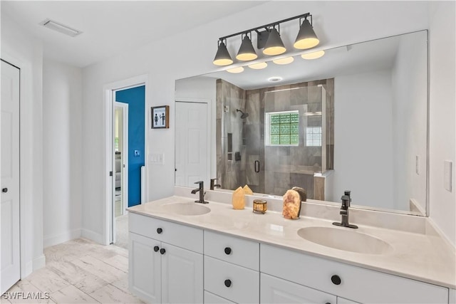 22 NW 14th Ave, Cape Coral, FL 33993 - full bathroom with double vanity, a shower stall, and marble look tiles