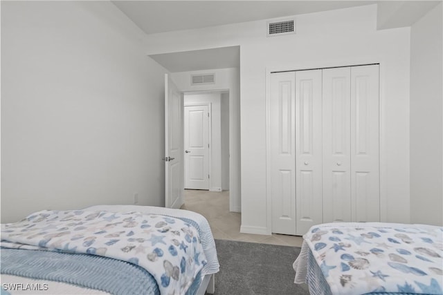 14818 Birchwood Ct Unit 6412, Punta Gorda, FL 33955 - bedroom featuring a closet, light tile patterned floors, and light colored carpet