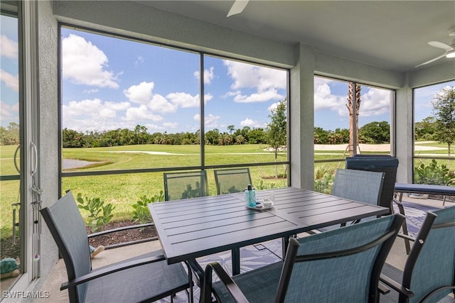 14818 Birchwood Ct Unit 6412, Punta Gorda, FL 33955 - sunroom / solarium featuring ceiling fan, view of golf course, and outdoor dining area