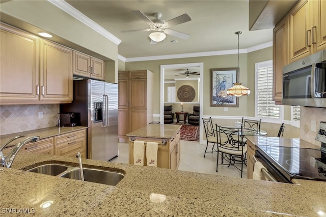 713 Regency Reserve Cir Unit 5903, Naples, FL 34119 - kitchen with stainless steel appliances, a ceiling fan, light stone counters, tasteful backsplash, and light tile patterned flooring