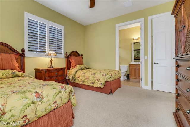 713 Regency Reserve Cir Unit 5903, Naples, FL 34119 - bedroom featuring light carpet, connected bathroom, and ceiling fan