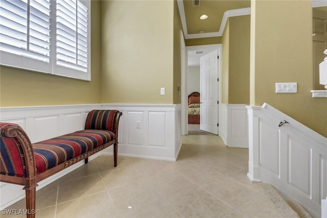713 Regency Reserve Cir Unit 5903, Naples, FL 34119 - sitting room with a decorative wall, light tile patterned flooring, wainscoting, and ornamental molding