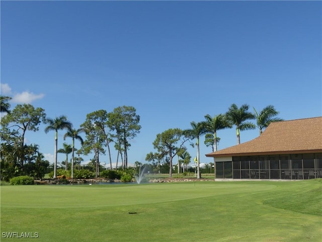 79 Glades Blvd Unit 1623, Naples, FL 34112 - view of home's community with view of golf course and a lawn