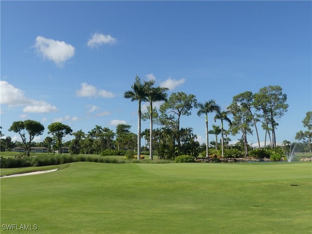 79 Glades Blvd Unit 1623, Naples, FL 34112 - view of property's community with golf course view and a lawn