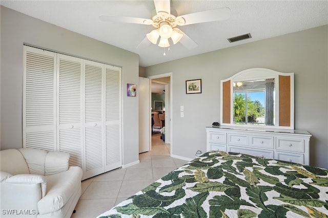 79 Glades Blvd Unit 1623, Naples, FL 34112 - bedroom featuring light tile patterned flooring, a closet, and ceiling fan