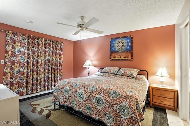 79 Glades Blvd Unit 1623, Naples, FL 34112 - bedroom with ceiling fan and a textured ceiling