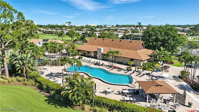 79 Glades Blvd Unit 1623, Naples, FL 34112 - community pool featuring a patio and golf course view