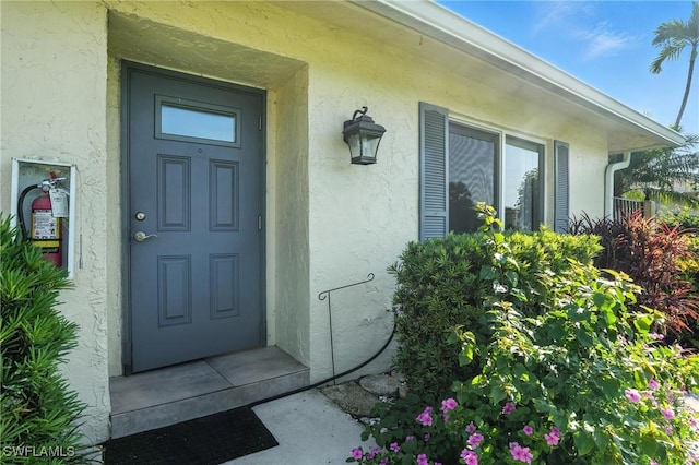 79 Glades Blvd Unit 1623, Naples, FL 34112 - property entrance featuring stucco siding