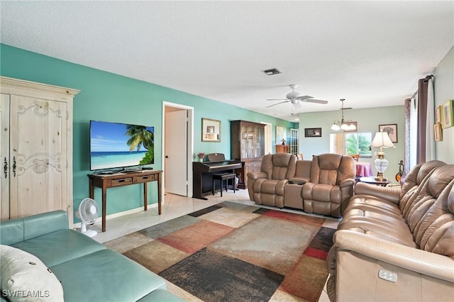 79 Glades Blvd Unit 1623, Naples, FL 34112 - living room featuring a chandelier, ceiling fan, and light tile patterned floors