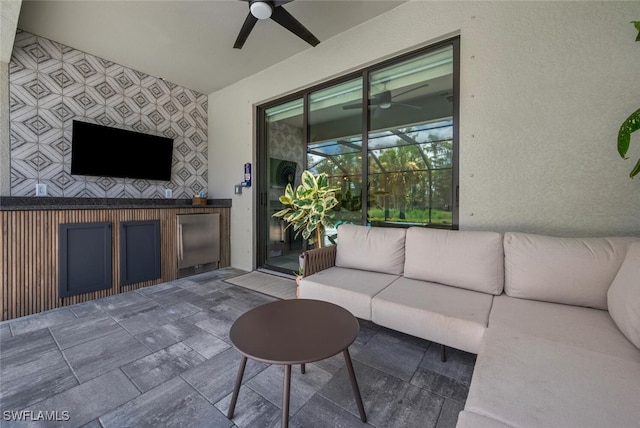 17573 Ashcomb Way, Estero, FL 33928 - living area with a ceiling fan, a sunroom, and stone finish flooring