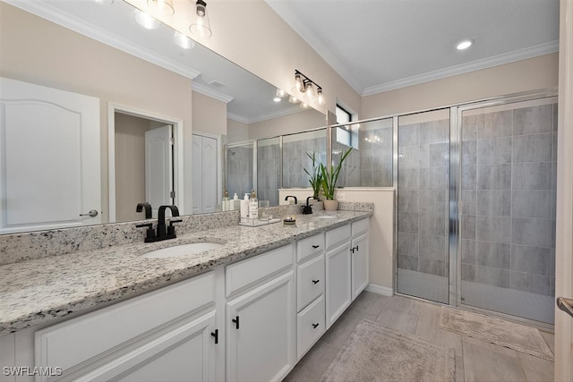 17573 Ashcomb Way, Estero, FL 33928 - bathroom with double vanity, a stall shower, and crown molding