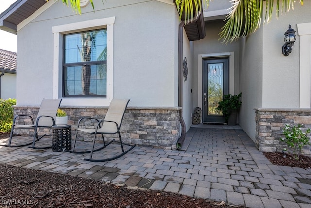 17573 Ashcomb Way, Estero, FL 33928 - entrance to property with stone siding and stucco siding